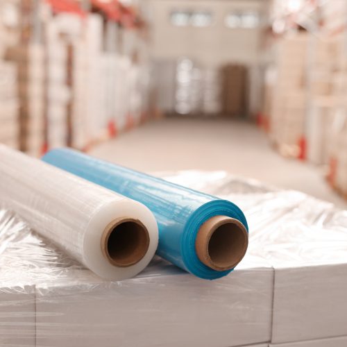 Rolls of different stretch wraps on boxes in warehouse